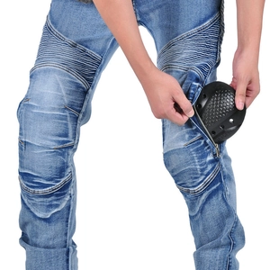 Close-up of flexible accordion panels and protective armor pocket on biker jeans