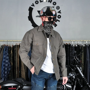 Detail of grey heavy canvas motorcycle riding shirt with double chest flap pockets