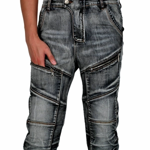 Detail of gray vintage motorcycle jeans featuring reinforced stitching and metal zippers