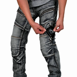 Detail view of motorcycle jeans showing the thigh pocket and multi-zippered tool pouch storage