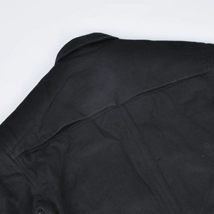 Detail view of reinforced stitching on the back and collar of this black motorcycle jacket