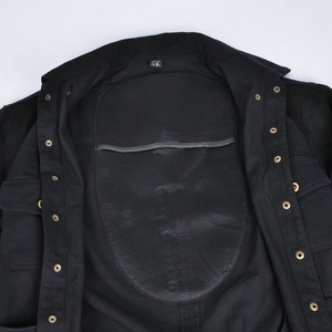 Detail of motorcycle jacket interior with mesh armor pockets and metal snap buttons