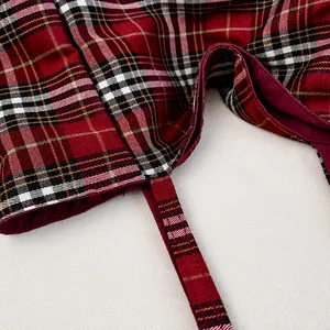 Close-up of classic red and black plaid canvas tote bag with precise stitching details