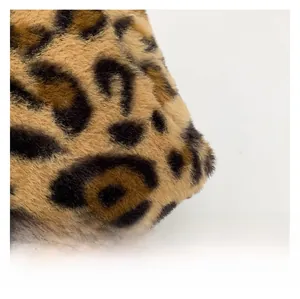 Close-up of high-density faux fur material with premium brown leopard print texture