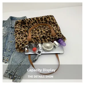 Spacious leopard faux fur tote bag showing interior storage for laptop and essentials