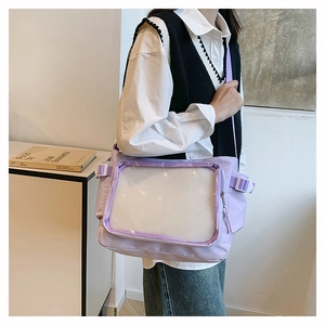 Detail of lavender ita bag featuring a large clear window and adjustable strap