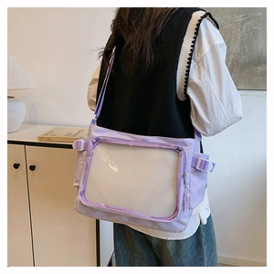 Detail of purple ita bag with transparent window and adjustable straps for badges