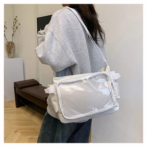 White ita bag detail showing large transparent PVC window for pins and badges