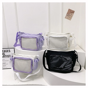Detail view of canvas messenger bags in purple and black with mesh zipper pockets