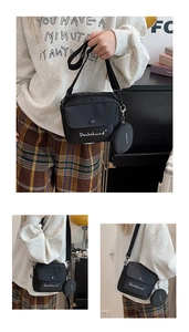Detailed view of black nylon crossbody bag with mini pouch and Dachshund print