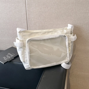 White minimalist canvas tote bag with front mesh pocket and adjustable shoulder strap