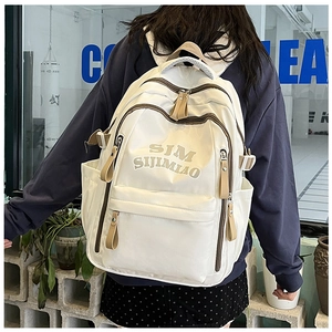 Detailed back view of white nylon backpack featuring SJM SIJIMIAO embroidery and zip pockets