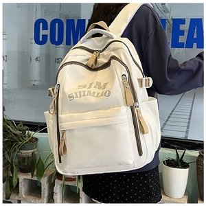 Detail of white large capacity laptop backpack with contrast zippers and side pocket