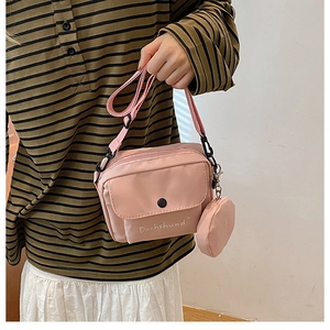 Pink canvas shoulder bag with a matching round mini coin purse and Dachshund print
