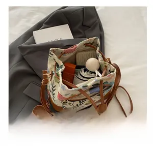 Detail shot of the large capacity interior of the floral ethnic canvas bucket bag