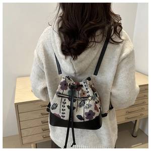 Detailed view of vintage ethnic floral bucket bag featuring premium woven embroidery textures