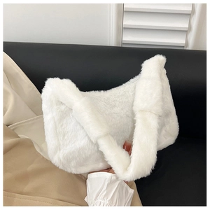 Close-up of white plush faux fur shoulder bag with soft texture for winter season