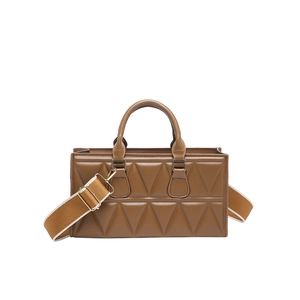 Caramel brown handbag with triangle quilting and contrasting wide crossbody strap