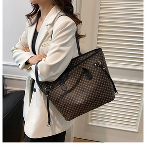 Detailed view of tote bag side with drawstring and geometric pattern on model