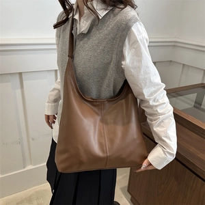 Brown faux leather hobo shoulder bag with minimalist design for winter casual work