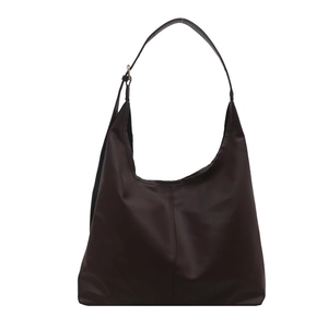 Minimalist large dark brown hobo shoulder bag with adjustable strap and vertical seam
