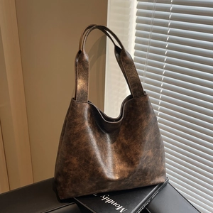Retro dark brown large tote bag with vintage leather texture and soft Hobo silhouette