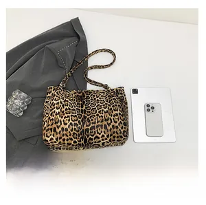 Flat lay of large leopard print tote bag with iPad and phone for size reference