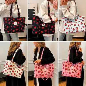 Collage of model wearing strawberry print canvas tote bags in four various colors