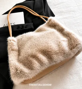 Close-up of beige plush faux fur tote bag with brown leather straps for autumn fashion