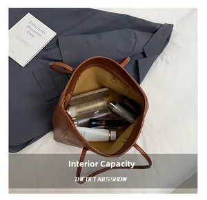 Interior view showing the large storage capacity of the brown tote bag for daily essentials
