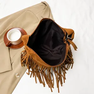 Interior view of large capacity dark brown faux suede fringe tote with zipper closure