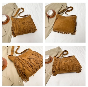 Close-up of brown faux suede tassel bag with fringe details and adjustable strap
