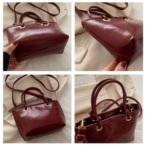 Detailed views of a glossy dark red bucket bag with gold hardware and strap details