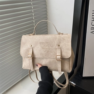 Retro beige leather backpack for students with metal buckle straps and marble texture