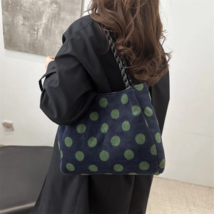 Blue woven wool tote bag with green polka dots and braided leather chain strap
