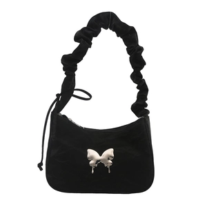 Minimalist black ruched shoulder bag with metallic butterfly buckle and wavy handle