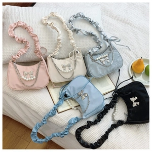 Fashionable crescent shoulder bag with pearl chain and bow detail in five elegant colors