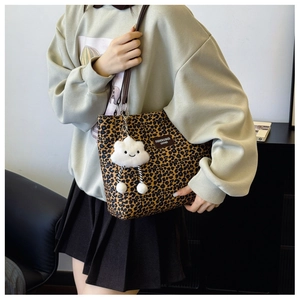 Chic leopard print bucket tote bag featuring a cute white cloud plush pendant and leather straps