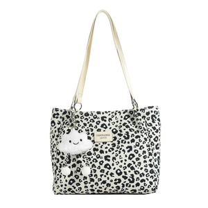 Fashionable leopard print tote bag with adjustable cream shoulder strap and cloud pendant