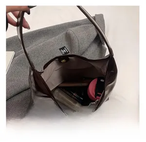 Top view of the brown patent leather tote bag showing large capacity and magnetic buckle