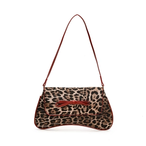 Leopard print baguette bag for women with red patent leather bow and shoulder straps