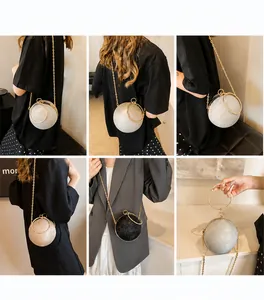 Detail of round glitter evening bags with metal ring handles and gold chain straps