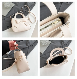 Dettaglio borsa a mano in pelle PU color crema con fiocco e chiusura lampo