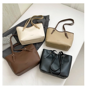 Tote bags in white, beige, brown, and black with adjustable straps for commuting
