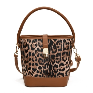 Chic leopard print bucket bag with brown leather trim and detachable shoulder strap