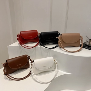 Retro PU leather crossbody handbags for women in five colors on a white display stand