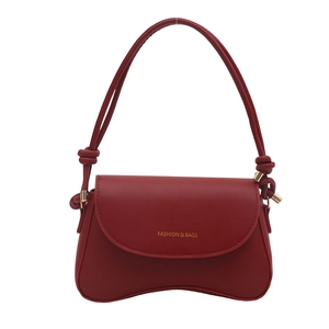Red leather underarm bag with curved base and Fashion & Bags gold lettering