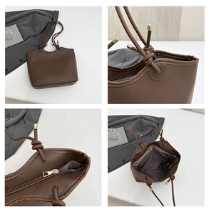 Detail view of coffee brown tote bag with fashion text, zipper closure and interior structure