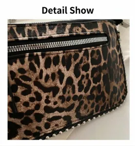 Detail shot of leopard print handbag with silver studs and a metallic zipper