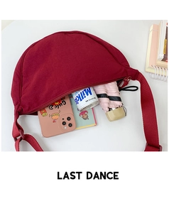 Interior view showing large capacity of the burgundy canvas dumpling crossbody bag